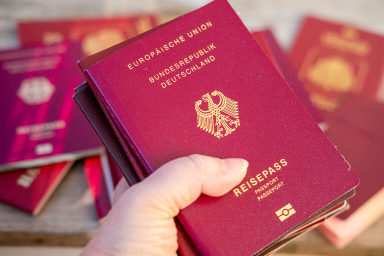 Stacks burgundy European and German International Reisepass, passports travel document, Border control and verification, customs, Migration and mobility, administrative office, necessary paperwork